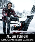 Man using snow blower wearing WorkTunes Connect Hearing Protector With Bluetooth Wireless Tech And High Fidelity Sound 24 DB NRR Earmuffs