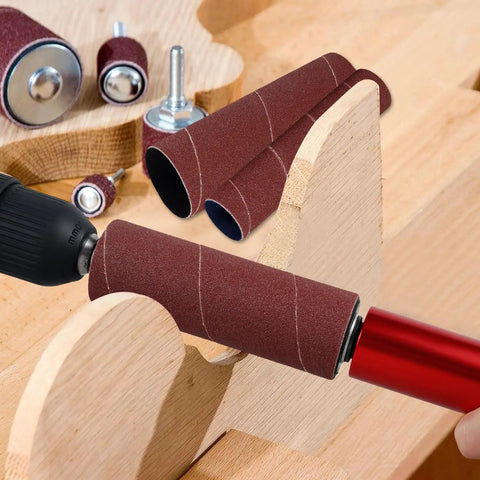 Handheld Rubber Sanding Drum Set With 120 Grit Sleeves with drill attachment on wood surface showcasing sanding sleeves.