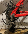 Close-up of a bike featuring Universal Bicycle Derailleur Hanger Replacement 2 Pack Frame Gear Tail Hook in use on a mountain bike.