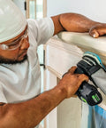 Worker using Granat PRO Delta Sanding Pad Set 10 Pack With Flexible Foam Backing For Curves And Contours 100 mm Delta Shape