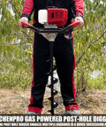 Man operating Beefy Gas Powered Post Hole Digger With 52cc Engine And 1800W Power in a garden setting