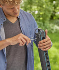 Person using tools on Ditch The Mess With This Slick Wall Rack Built For Garden Tools And Hand Pruners.