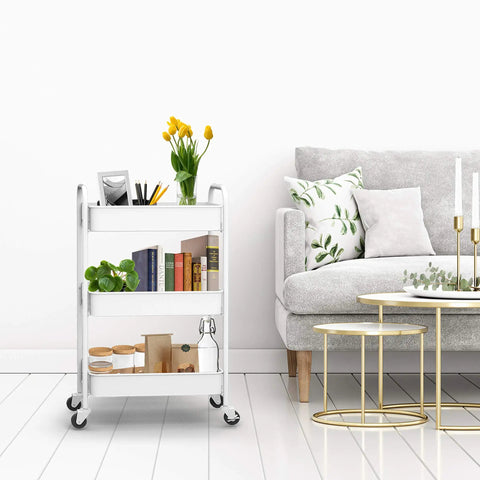 Three Tier Rolling Metal Storage Organizer On Wheels White Mobile Utility Cart With Caster Wheels near sofa in living room