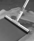 Heavy Duty Floor Squeegee With Flexible Silicone Blade And Long Aluminum Handle For Streak Free Bathrooms Showers Tiles Driveways And Glass That Makes Mopping Obsolete Now on wet surface.