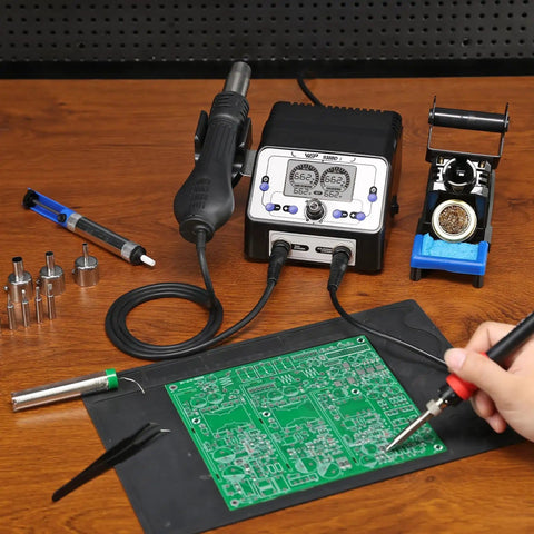 Person using 2 In 1 Soldering Iron Station And Hot Air Rework System With LCD Display, PID Temp Control, and solder wire on circuit board.