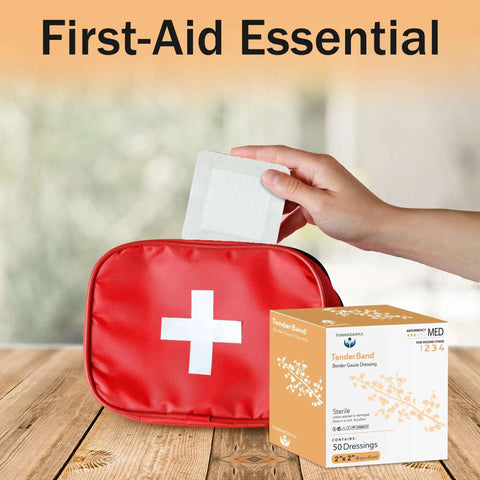 Box of Bordered 2x2 Sterile Adhesive Gauze Pads next to first-aid kit, hand holding a gauze pad, for wound protection.