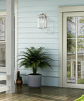 Transitional Three Light Outdoor Wall Lantern From Nyack Collection in brushed nickel finish on a porch wall
