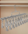 Heavy Duty Stainless Steel Vertical Closet Hanger For Pants And Leggings Space Saving Multi Tier Wardrobe Organization Rack shown in gray with clips.