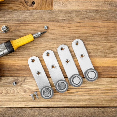 Buttery Smooth 4 Pack Sliding Door Pulley Wheels With Silent Rubber Bottom Rollers And Rock Solid Construction For Easy Side Mount Closet Barn Door Track Hardware Replacement, silver rollers on wooden surface.