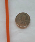 Heavy Duty Two Hundred Fifty Foot Spool Of One Eighth Inch Galvanized Aircraft Cable With Bright Orange Pvc Coating next to a quarter for size comparison.
