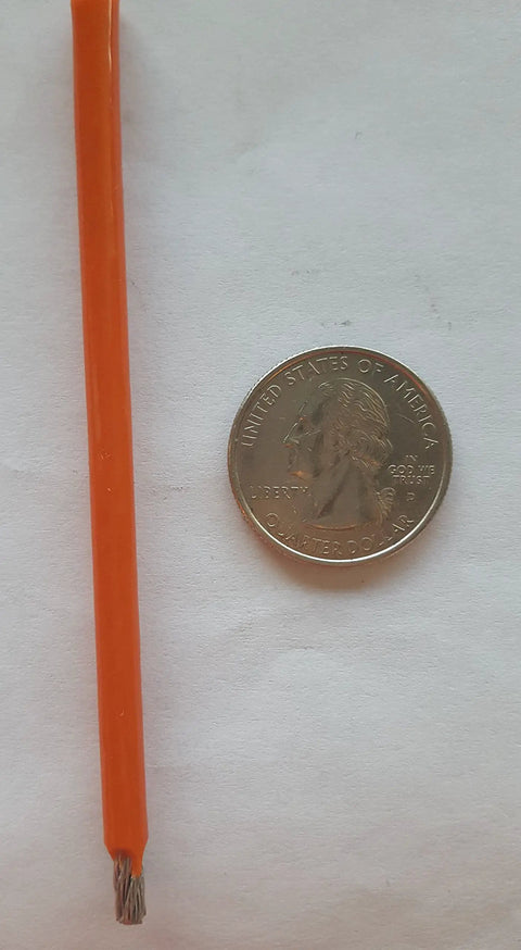Heavy Duty Two Hundred Fifty Foot Spool Of One Eighth Inch Galvanized Aircraft Cable With Bright Orange Pvc Coating next to a quarter for size comparison.