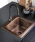 15-Inch Baxter Drop-In Pure Copper Bar Sink With Hand-Hammered Finish installed in a modern kitchen countertop