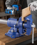 Heavy Duty Bench Vise With 6.5 Inch Jaw Width And 5 Inch Opening, Beefy Multi Purpose Ductile Iron Vise With Anvil And 360 Degree Swivel Base, Built For Tough Jobs With 5620 Lbs Clamp Force holding wood plank securely
