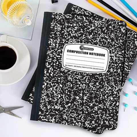 Bulk 50 Pack Composition Notebooks With Hard Covers, College Ruled, 200 Pages Each, 9.75 by 7.5 Inches, Black Marble Journal on desk
