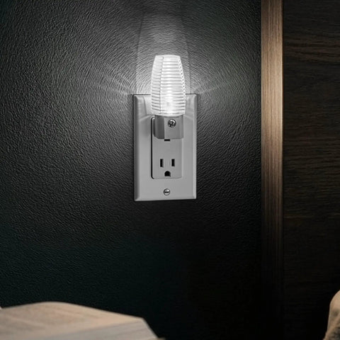 Plug In LED Night Light With Dusk To Dawn Sensor, 5000K Daylight, 5 Lumen Output in wall socket illuminating a dark room