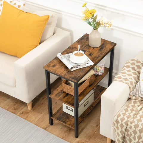 Rustic Brown And Black 3 Tier End Table With Open Storage Shelves Sleek Industrial Side Stand Fits Snugly In Tiny Spaces placed beside a sofa