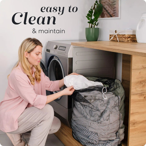 Woman using Heavy Duty Mesh Laundry Bag Large 24 By 36 With Secure Drawstring Closure in laundry room