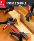 4 heavy duty nylon clamps with easy grip handles securing wooden boards, showcasing 7-Inch Spring Clamps Set Of 4 Heavy Duty Nylon Clamps.