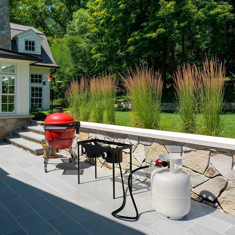 NUPICK 6ft adjustable propane regulator with gauge and hose, black, connected to LP tank beside outdoor grill on patio