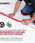Person applying red tape with recycled content label, promoting environmentally safe and 100% recycled materials.