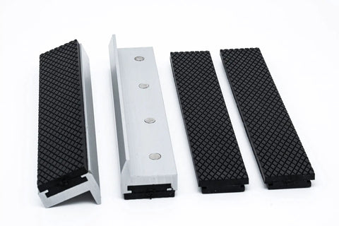 Rock Solid Six Inch Aluminum Vise Jaws Featuring Thick Rubber Gripping Pads And Super Strong Embedded Magnets in four pieces.