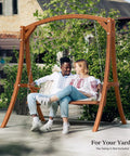 Couple sitting on swing supported by 6.7Ft Porch Swing Frame Built Tough Heavy Duty A Frame Stand With 1000lbs Capacity Solid Wood