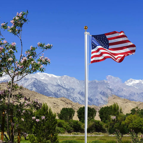 American flag on a pole in a scenic mountain landscape, using Rugged Nylon Flag Pole Rope Kit 50 Feet Long One Quarter Inch Diameter