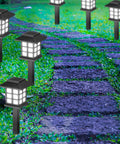 20 Pack Solar Pathway Lights For Outdoors illuminating a stone walkway with a cold white glow, waterproof LED garden lights at night.