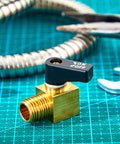 Brass mini air compressor drain valve with black ON/OFF lever; 1/4 in NPT male x female connectors