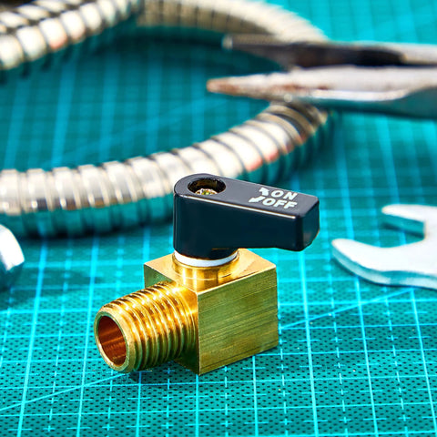 Brass mini air compressor drain valve with black ON/OFF lever; 1/4 in NPT male x female connectors