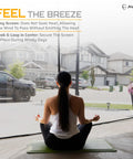 Woman sitting in front of open Garage Door Screen 16x8 For A 2 Car Garage With Hands Free Entry, looking outside