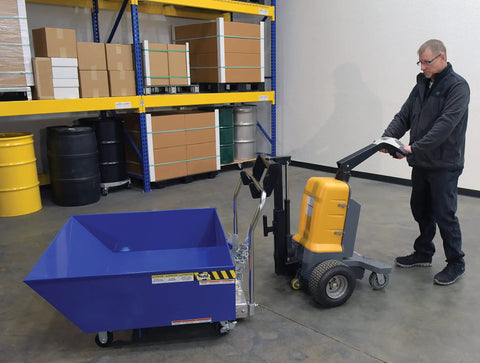 Heavy Duty Electric Powered Tugger With 1000 Lb Pull Capacity For Effortless Factory Material Handling in use with blue bin.
