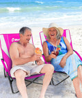 Couple relaxing on Low Beach Chair With Removable UPF 50 Plus Umbrella Lightweight Folding Backpack Style Camp Chair at beach