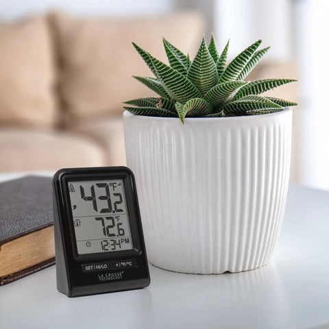 Battery Operated Wireless Digital Thermometer For Indoor Outdoor Temperature With 24 Hour High Low Records No Backlight Monochrome Display Hassle Free Setup 12 24 Hour Time Mode Signal Strength And Low Battery Alerts Built For Everyday Home Use on desk