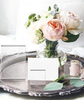 Set Of Six Clear Acrylic Styling Blocks And Flat Lay Props Ideal For Wedding Centerpieces And Product Shoots, showcases blocks next to flowers.