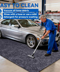 Man cleaning Triple Layer Garage Floor Mat With Waterproof Barrier And Non Slip Backing Heavy Duty Reusable Absorbent Surface