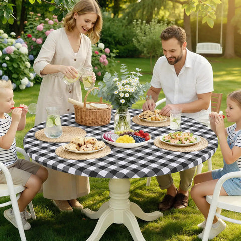 Family dining outdoors on a round table with a black and white buffalo plaid tablecloth, matching the Round Picnic Tablecloth With Elastic Edges Waterproof Fitted Vinyl Cover For 36 to 44 Inch Tables Flannel Back Buffalo Plaid Black And White No Slip Windproof Outdoor Dining.