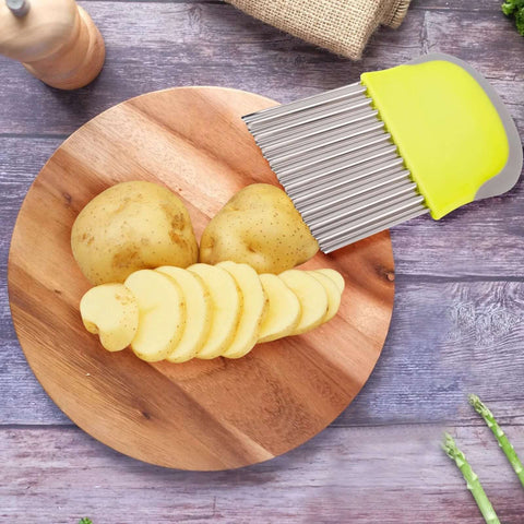 Crinkle cutter knife with yellow handle and stainless steel wavy blades for slicing potatoes into fries