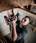 Person using Cordless Impact Driver With One Quarter Inch Hex Drive, 200 Nm Torque, Brushless Motor For Beast Mode Speed And Efficiency in tight space