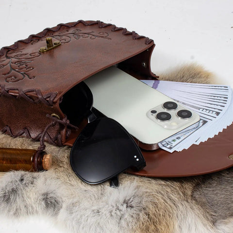 Vintage Brown Faux Leather Medieval Belt Pouch Featuring Carved Elven Leaf Details with a phone, money, and sunglasses.