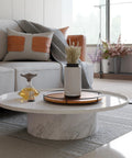 16-inch TIDITA acacia wood lazy Susan turntable with metal frame on a white coffee table in a living room