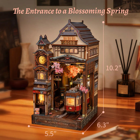 Cherry Blossom Sakura Train Book Nook Kit With LED 3D Wood Puzzle And Infinity Mirror on desk, featuring a detailed train scene.