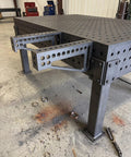 Built Tough 12 Inch Welding Clamping Square And Table Extension Kit featuring heavy-duty clamping fixtures on modular fixture table.