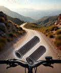 Dual Length Bike Handlebar Grips Set Long And Short Anti Slip TPR Rubber Grips For Mountain And Road Bikes displayed over a scenic bike trail