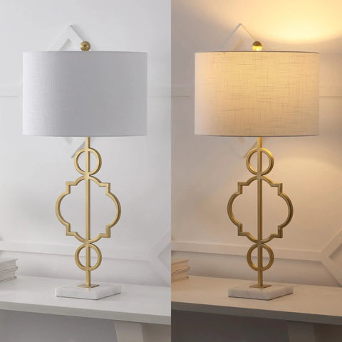 Gold Modern Quatrefoil LED Table Lamp with Marble Base and Linen Drum Shade on desk, showcasing light on and off states
