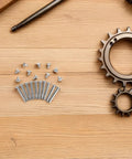 Folding Fan Shaft Rivet Nail And Nut Repair Kit 25mm Set For DIY Hand Fans Folding Paper Fans And Dance Fans Includes Rivets Nuts And Hardware For Quick Easy Fixes And Pro Level Repairs. 25mm metal rivets and nuts on wood surface