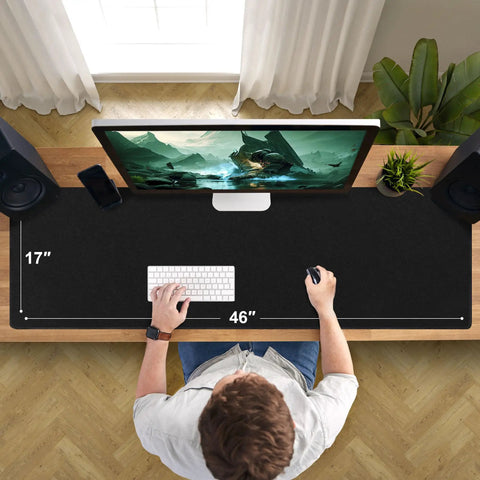Top view of a desk with a Huge 46 By 17 Inch XXL Thick Gaming Mouse Pad For Gamers Extra Large Extended Desk Mat with non-slip base.
