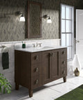 Devonshire Style Wall Sconce Bath Vanity Light With Frosted Glass Shade, Brushed Nickel Finish, mounted in elegant bathroom setting.
