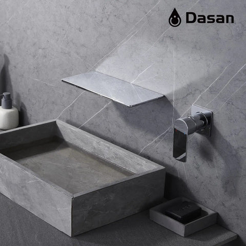 Wall Mount Bathroom Faucet With Waterfall Spout In Wall Design Single Handle Polished Chrome Sink Faucet 11 Inch Wide Spout Slick Space Saving CUPC Ceramic Cartridge SA BFW1 CH shown on stone wall above sink