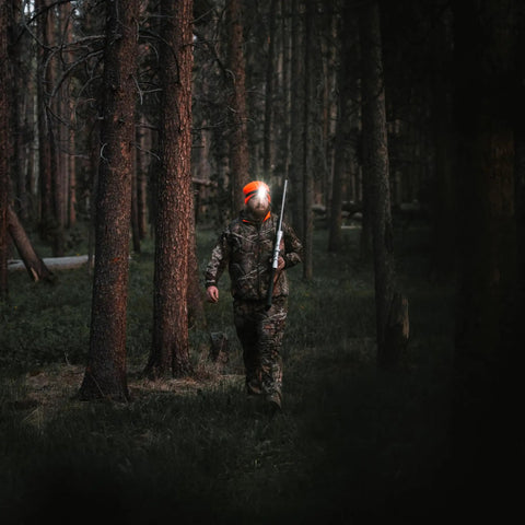 Person using Remix LED Headlamp With 450 Lumens Multicam Camo Finish Red LEDs For Night Vision IPX4 Water Resistant